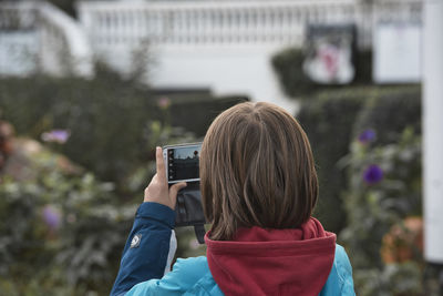 Portrait of woman photographing