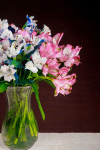 Close-up of pink flower vase on table