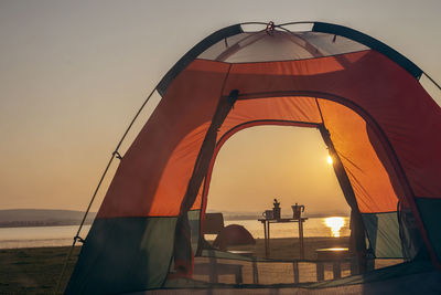 Scenic view of sea against orange sky