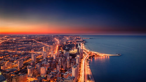 Aerial view of illuminated city at night