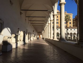 Rear view of people in corridor