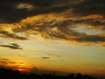 Low angle view of dramatic sky during sunset