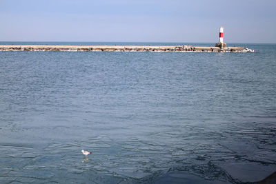 Scenic view of sea and buildings against sky