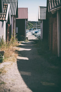 Empty alley amidst buildings in city