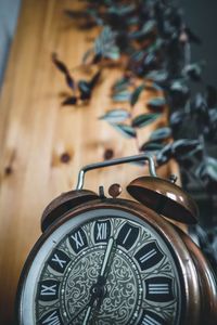 Close-up of clock on table