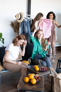 Happy females shopping at store