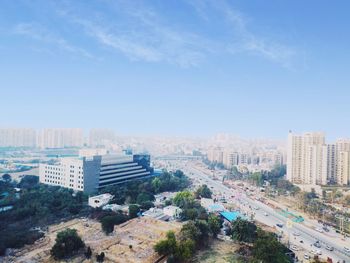 High angle view of buildings in city against sky