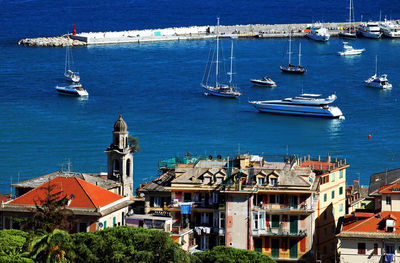 Boats on sea moored by cinque terre