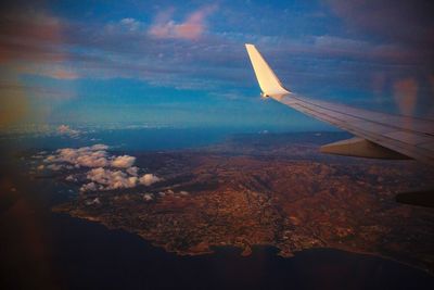 Airplane wing against sky