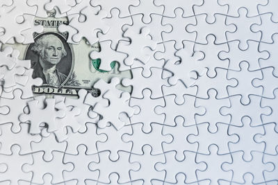 Full frame shot of numbers on glass against white background