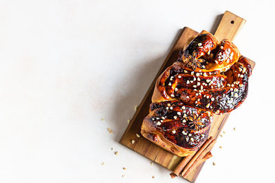 Babka or brioche bread with apricot jam and nuts. homemade pastry for breakfast. 