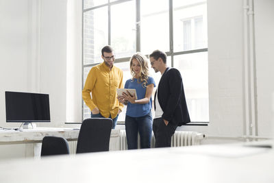 Colleagues having a meeting in office