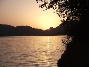 Scenic view of lake against sky during sunset