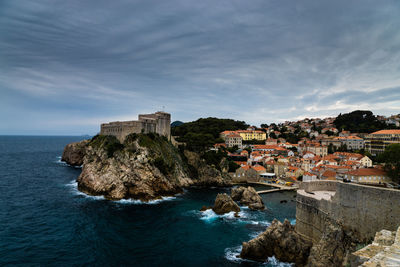 High angle view of town by sea