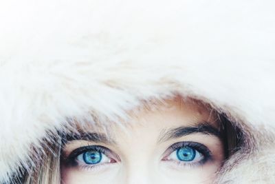 Close-up portrait of woman against white background