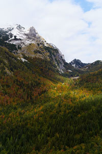 Scenic view of landscape and snowcapped mountains against sky in triglav national park slovenia