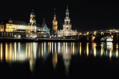 Reflection of illuminated buildings in water at night