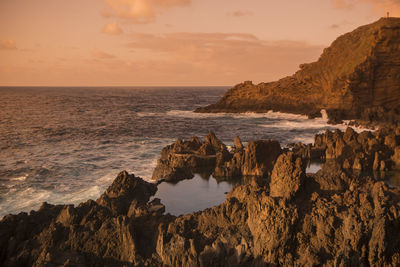 Scenic view of sea against sky during sunset