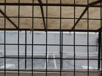 Full frame shot of metal fence against building