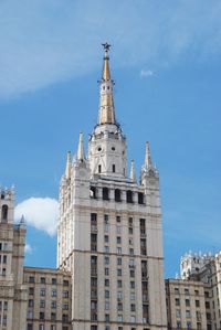 Low angle view of buildings against blue sky