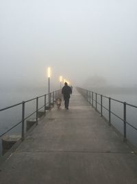 People walking on railing