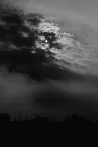 Scenic view of dramatic sky over silhouette landscape