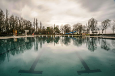 Scenic view of lake against sky during winter