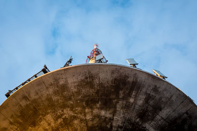 Low angle view of man against sky