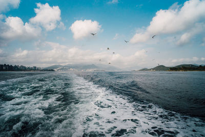 Scenic view of sea against cloudy sky