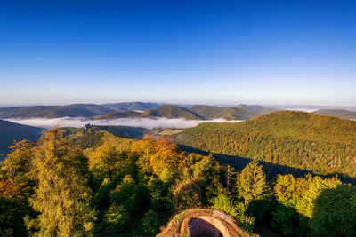 Scenic view of mountains against clear blue sky