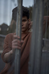 Portrait of man standing outdoors during winter