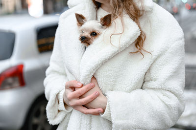 Midsection of woman with dog