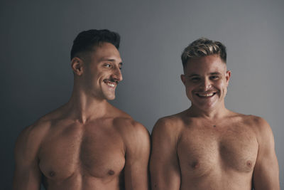 Portrait of two boys with smiling moustaches