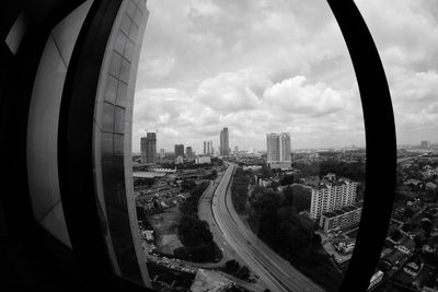 High angle view of buildings in city against sky