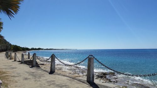 Scenic view of sea against clear blue sky