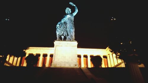 Low angle view of statue at night