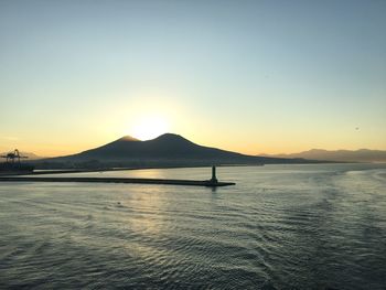 Scenic view of sea against clear sky during sunset