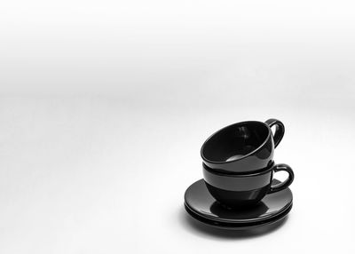 High angle view of eyeglasses on table against white background