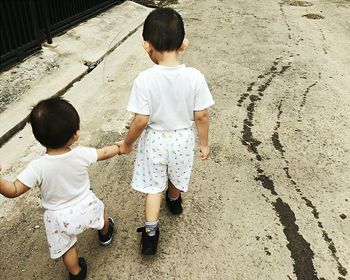 Children playing with baby