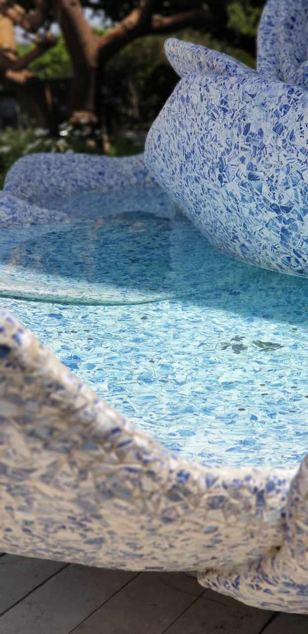 CLOSE-UP OF SWIMMING POOL AT SEA SHORE