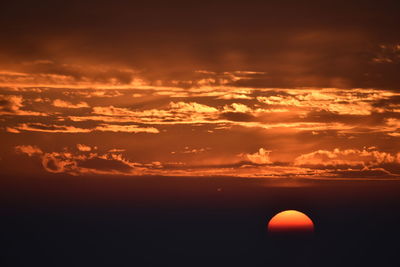 Scenic view of dramatic sky during sunset