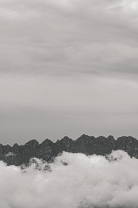 Scenic view of snow covered mountains against sky