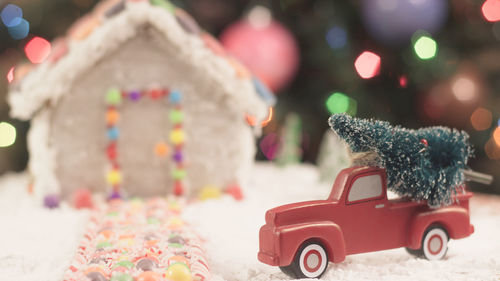 Close-up of toy car with christmas tree