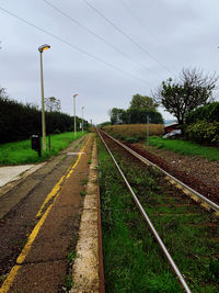 Railroad tracks against sky