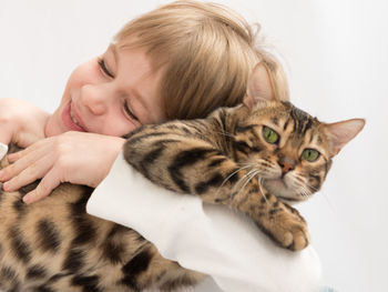 Portrait of cute girl with cat