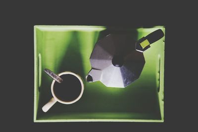 Coffee pot and cup in tray