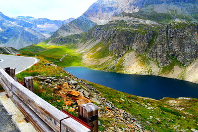 High angle view of lake amidst mountains against sky