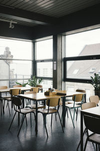 Empty desks and chairs at office