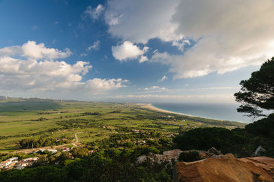 Scenic view of landscape against cloudy sky