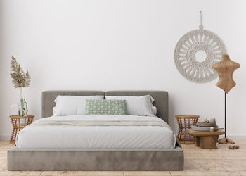 Empty white wall in modern bedroom. mock up interior in scandinavian, boho style. free, copy space 